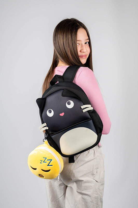 Snoozie The Sleeping Head Travel Pillow Set Model Wearing A Backpack